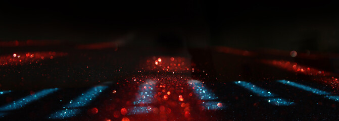 background of abstract blue, red and black glitter lights. defocused