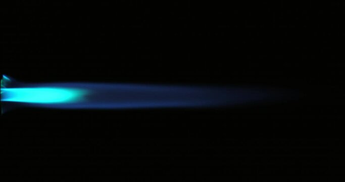 Gas flame isolated on black background. Blue fire shot on RED camera.