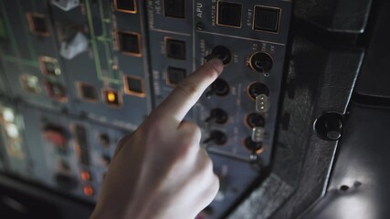Autopilot control element of an airliner.Panel of switches on an aircraft flight deck. Thrust levers of a twin engined airliner. Pilot controls the aircraft. Onboard computer, cockpit.