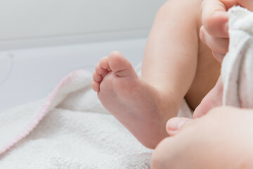 A baby's foot is always tender to look at.  The dressing of a baby is important in the first phase of growth.
