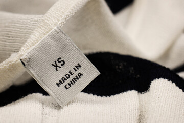 Made in China XS Label on a Black and White Blouse.