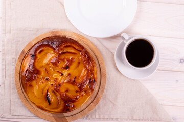 traditional homemade baked cake or tart and espresso in a cup