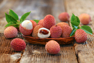 litchi, lichee, lychee, or lichi, Litchi chinensis on old rustic wood background