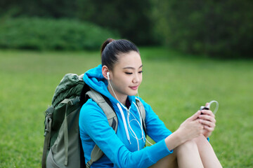 Young woman with backpack in outdoor