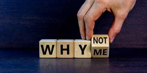 Why not me symbol. Businessman turns a cube and changes words why me to why not. Beautiful dark grey background. Business and why not me concept. Copy space.