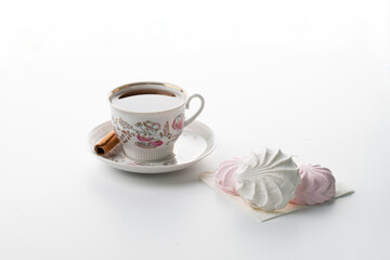 tea Cup marshmallows on sulfide selective focus on white background high key