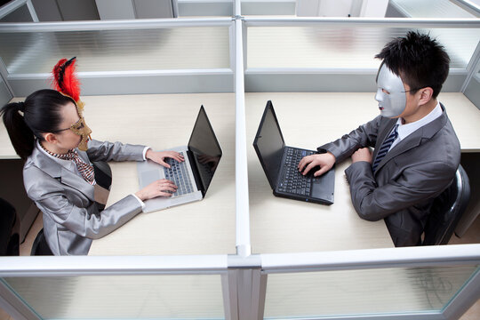 Business person sitting in office,wearing mask