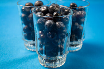 Fresh blueberries in a glass vase