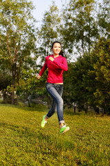 Young woman running outdoors