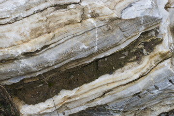 Old natural stone texture with multicolored layers