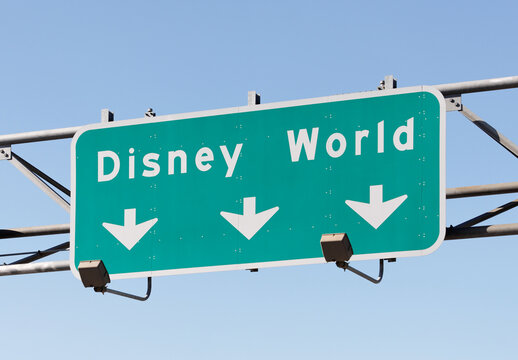 Orlando, Florida, USA - December 22, 2011: An interstate highway sign pointing the way to Walt Disney World. Walt Disney World is a large theme park and resort complex in Orlando, Florida.