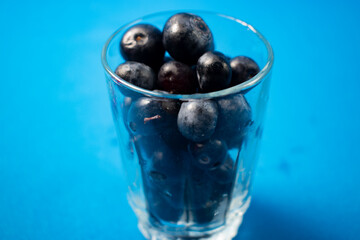 Fresh blueberries in a glass vase
