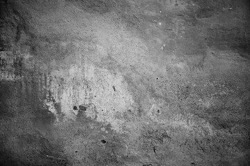 The concrete texture. The background is in the grunge style. Black and white photo