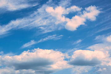 Pink and white clouds on the blue sky