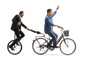 Man on a bicycle pulling another man with a tricycle and umbrella © Ljupco Smokovski