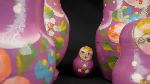 The tiny size of the matryoshka doll on the back of the bigger sizes