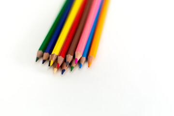 Close Up colored wooden pencils. Isolated on white background.