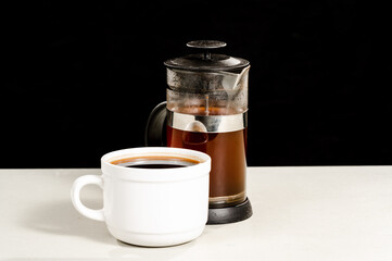 White Coffee Cup with French Press Coffee Maker