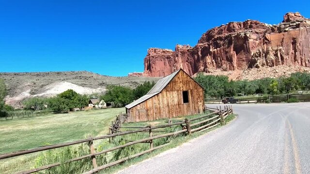 Driving through the Fruita District at Capitol Reef National Park, Utah. Camera mounted on a moving vehicle.