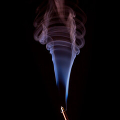 Multi color incense smoke on black