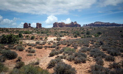 Fototapeta na wymiar Dazzling Arches National Park in the summertime with sandstone formations on a partly cloudy day in Utah