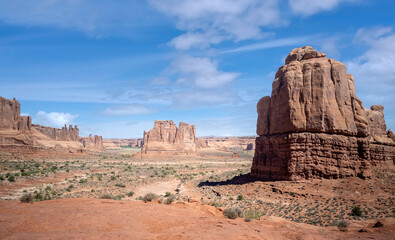 Dazzling Arches National Park in the summertime with sandstone formations on a partly cloudy day in Utah