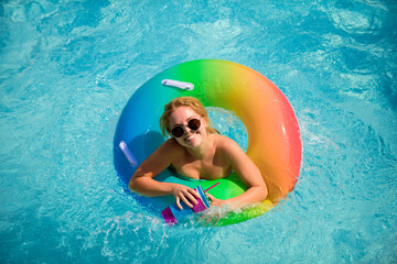 Summer happy woman in pool. Summertime girl in sunglasses. Summer leisure and holiday,