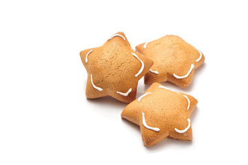 Freshly baked star shaped ginger cookies isolated on white background