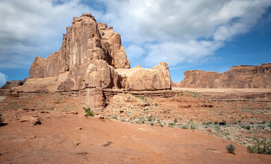 Fototapeta premium Dazzling Arches National Park in the summertime with sandstone formations on a partly cloudy day in Utah