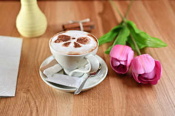 flowers and coffee on table 