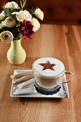 coffee with decorative star on cream 