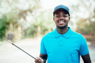 African golfer standing in golf course