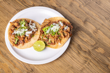 Roast tacos with corn tortillas. Mexican food. Mexican food concept on wooden table. Traditional Mexican food. Mexican tacos.