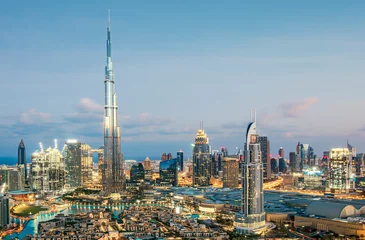 Behang Burj Khalifa View on modern skyscrapers and busy evening highways in luxury Dubai city,Dubai,United Arab Emirates