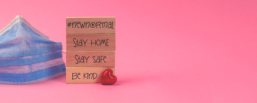 New normal 2021 concept, stay home and be safe valentine's day banner background with red heart, wooden blocks with a text