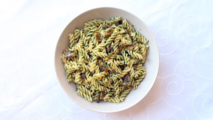 Plant based pasta dish with mushrooms, garlic, spinach and olive oil