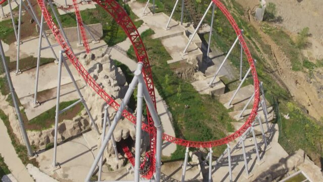 Rollercoaster and people having fun. Aerial reel frame video.