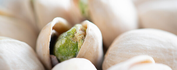 Macro shot of Pistachios in a panorama format for use as a banner or a header on a website. 
