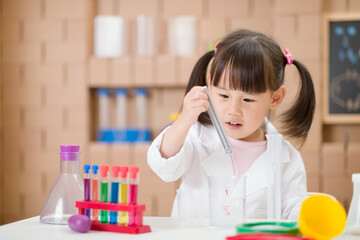 young  girl  play science experiments for homeschooling