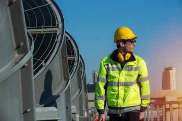 Confident supervisor on cooling tower.  Portrait  worker in protective on cooling Tower.