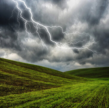 lightning over the meadow. stormy sky over rural landscape