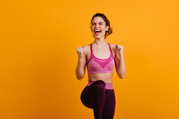 Ecstatic woman doing zumba. Enchanting girl enjoying training.