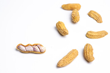 Boiled peanuts on white background, top thread view.