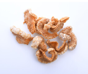 Pork snack or Pork rind leather lean pork fried crispy and blistered isoloated on white background. Thai food, Close-up