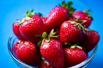 
Fresh strawberries on light blue background