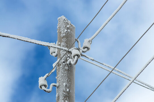 Frozen Electrical Wires On Power Lines In Winter