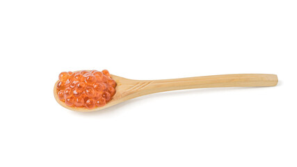 Wooden spoon filled with red caviar isolated on a white background.