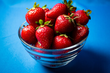
Fresh strawberries on light blue background