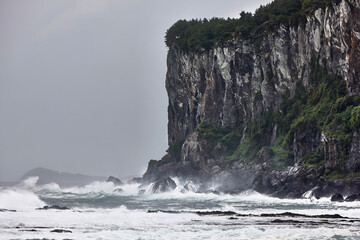 wave crashing on rocks