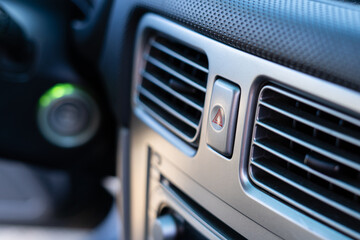 Button with a red triangle to turn on the emergency gang during an emergency in the car